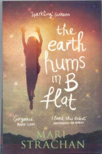 Cover of The Earth Hums in B Flat by Mari Strachan