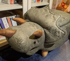 Photo of a triceratops-shaped footstool