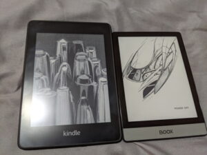 Kindle Paperwhite on the left, compared with an Onyx Boox Poke2 on the left. Screen up.